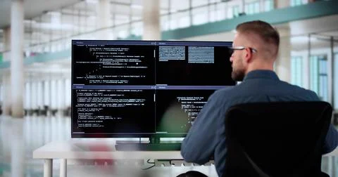 Computer Programmer Writing Program Code On Computer Photos