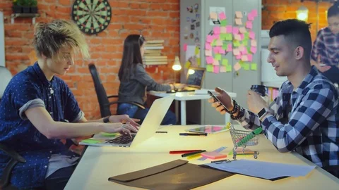 Computer programmers and web designers working in modern office IT company Stock Footage 90469224