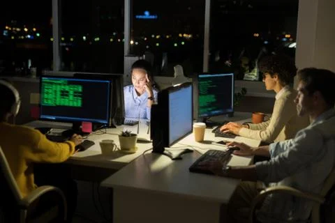 Computer Programmers Coding at Night Foto stock