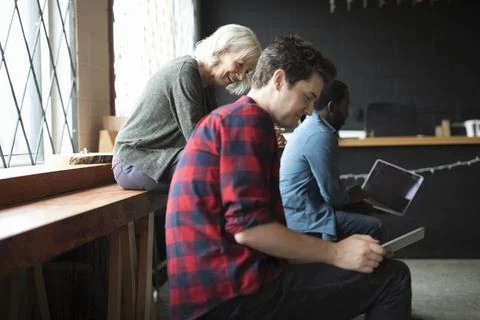 Computer programmers using digital tablet in office Stock-Fotos