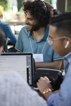 Computer programmers with virtual reality simulator working Stock-Fotos