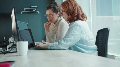 Computer programmers working on a code in a tech company Stock Footage 233970470