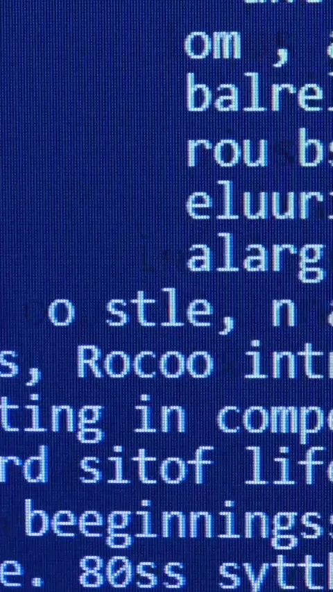 Computer programming code runs through a blue screen. Vertical video 動画素材 248375698