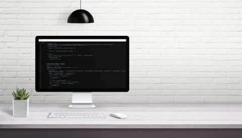Computer programming on computer display with free space on brick wall for te Stock Photos