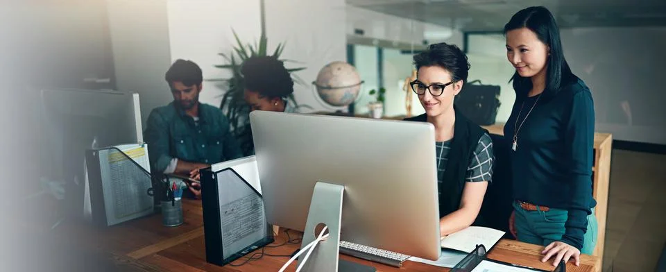 Computer, programming or web development with business people in office for Stock Photos