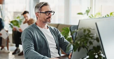 Computer programming, typing and web development with man in creative workplace Foto stock