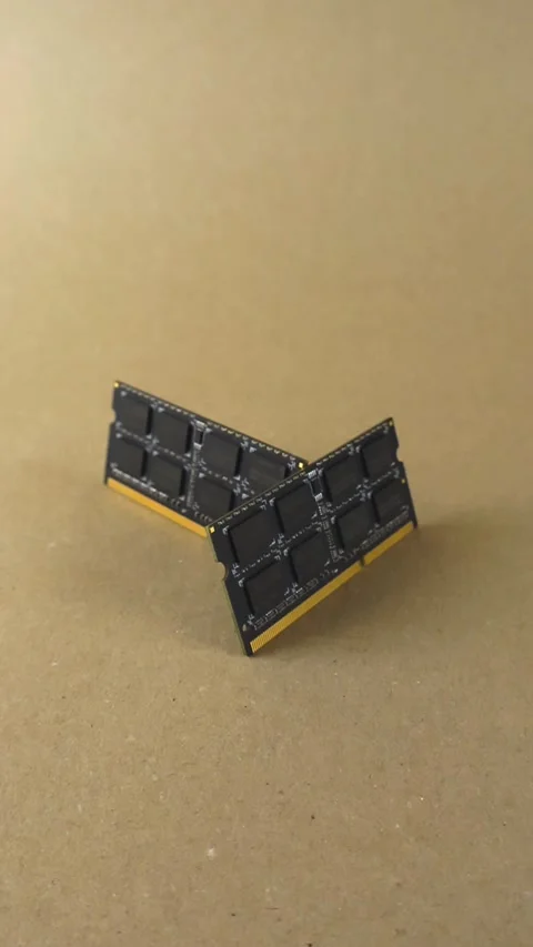 Computer RAM chips orbiting on a brown background Stock Footage 346022323