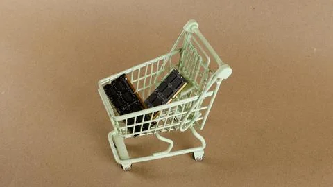 Computer RAM chips purchasing in a small shopping cart Stock Photos