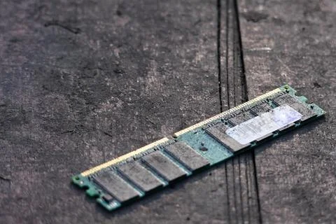Computer RAM memory module on dark textured surface Stock Photos