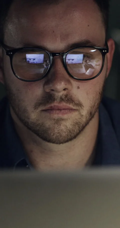 Computer, reading and business man at night for online project, finance proposal Stock Footage 329765309