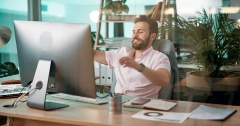 Computer, relax and web development with man coding software in office for 库存影片 305896465