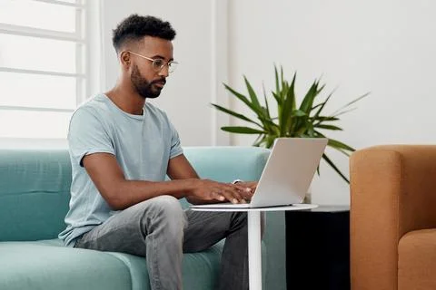 Computer, remote work and black man typing in home for research, project or 스톡 사진
