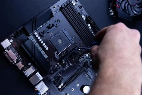 Computer repair on a black background Stock Photos