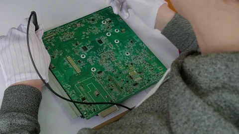 Computer repair service, hands of man tech testing motherboard with tools Stock Footage 76625007