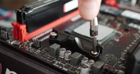 A computer repair technician installing a new gaming pc cpu on a Stock Footage 138913980