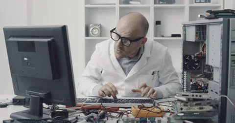 Computer repair technician working on a PC Stock Photos