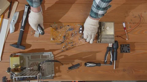 Computer repairman puts tools on the table Stock Footage 129970365
