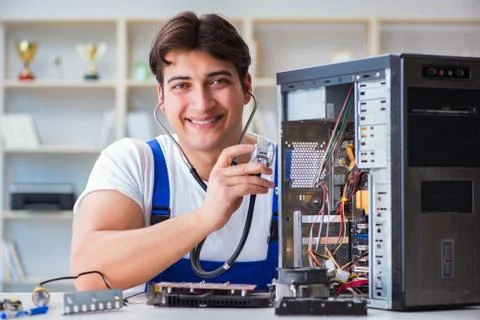 Computer repairman repairing desktop computer 스톡 사진
