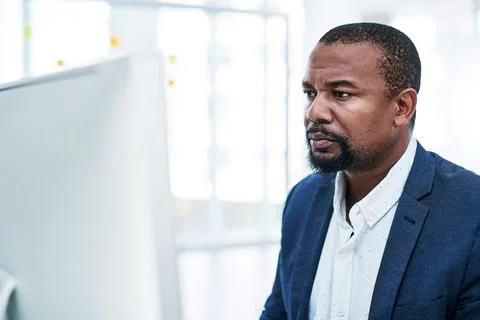 Computer, research and black man reading in office with financial report Stock Photos
