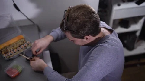 Computer room. The programmer during a lunch. The man is hungry and has decided Stock Footage 72457894