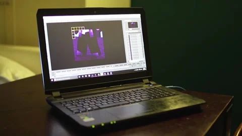 Computer running Cinema4D 3D modeling software rendering animation scene from 3D Stock-Footage 158735842