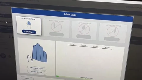 Computer saving fingerprint scan of migrant at processing center, Texas Video stock 150426091