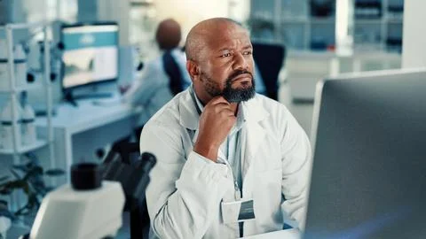 Computer, science and solution with black man in laboratory for medical Stock Photos