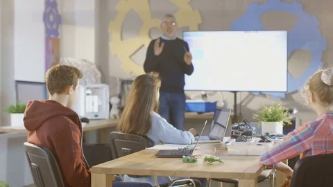 In a Computer Science Class Teacher Explains Programming to Kids Stock Footage 75783709