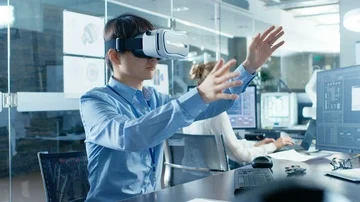 Computer Science Engineer wearing Virtual Reality Headset Works with 3D Stock Footage 85770395