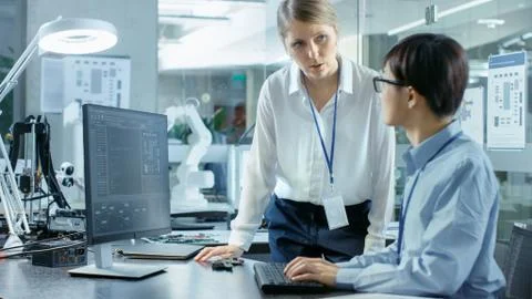 Computer Science Engineer wearing Virtual Reality Headset Works with 3D Model Stock Photos