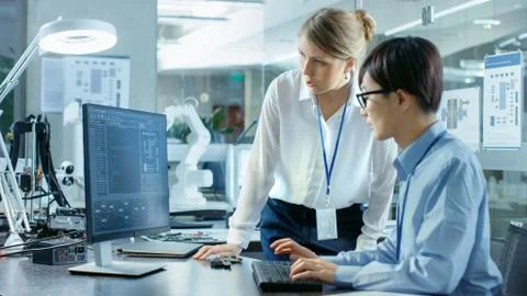 Computer Science Engineer wearing Virtual Reality Headset Works with 3D Model Stock Photos