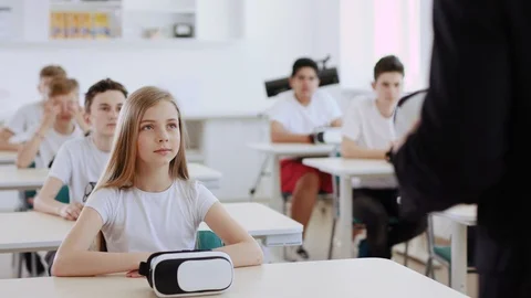 Computer science futuristic class. View of male teacher explaining how virtual Video stock 111542715