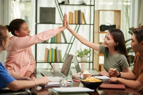 Computer Science Students Giving High Five Foto stock