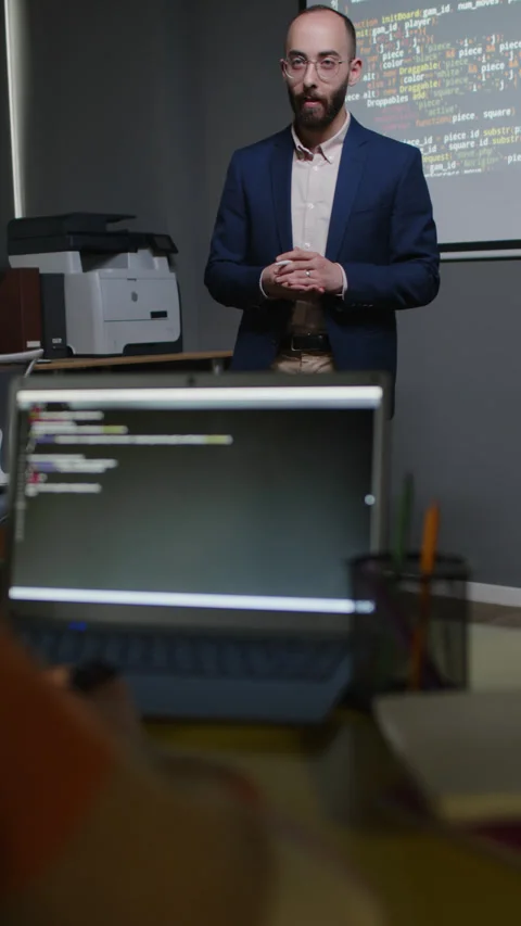Computer Science Teacher Giving Lecture on Coding in front of Projector Screen Video stock 278120648