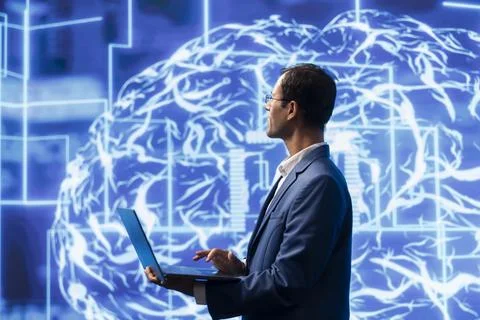 Computer scientist analyzes AI brain models on tablet Stock Photos