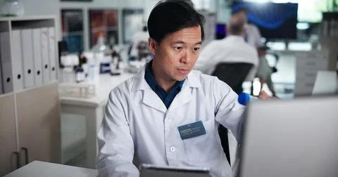 Computer, scientist and thinking with man in laboratory for healthcare, medical Foto stock