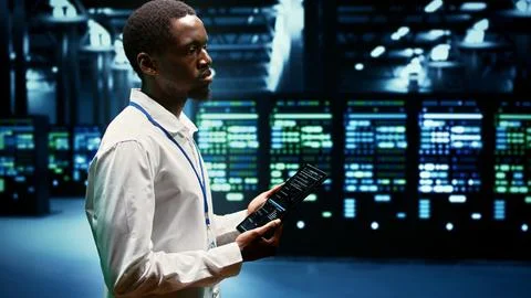 Computer scientist checking server rows 写真素材