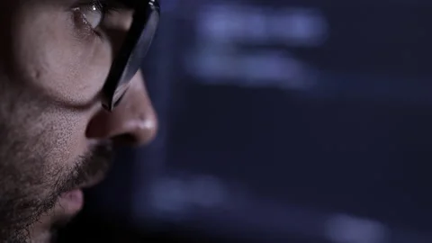 Computer Scientist Close Up. Hacker or programmer. Low key light, closeup Stock Footage 192424565