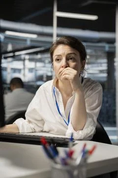 Computer scientist in data center running diagnostic scripts on computer Stock Photos