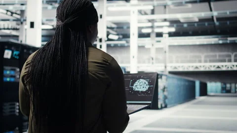 Computer scientist doing data center automation using AI on laptop Stock Footage 317203972