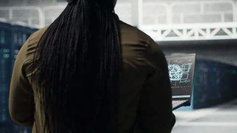 Computer scientist doing data center automation using AI on laptop Stock Footage 317206699