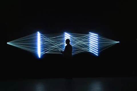 Computer scientist fine tuning AI agent synapses to upgrade processing speed Stock Photos