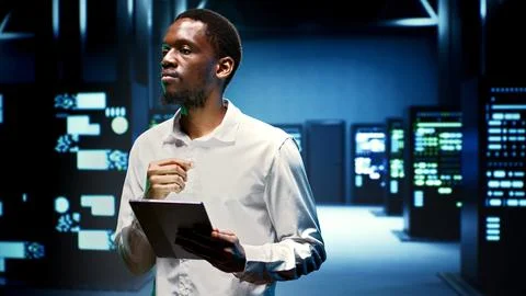 Computer scientist in high tech room Stock Photos