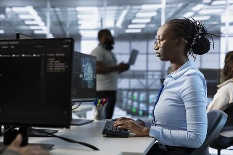 Computer scientist managing and optimizing data center infrastructure 스톡 사진