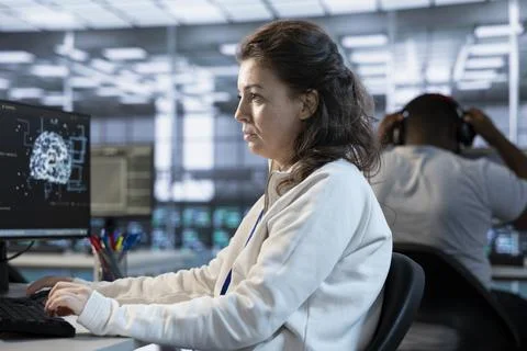 Computer scientist programming in AI data center Foto stock