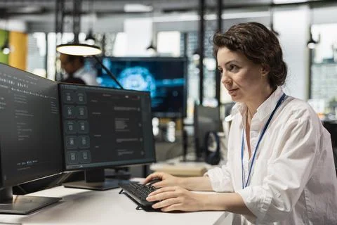 Computer scientist running AI large language model chatbot on PC in startup Stock Photos