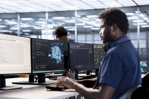 Computer scientist in server room workspace using artificial intelligence Stock Photos