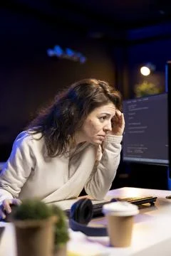 Computer scientist suffers from headache after inspecting coding Stock Photos