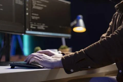 Computer scientist typing on keyboard, testing and debugging code, close up 写真素材