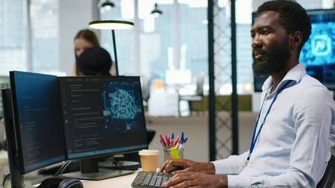 Computer scientist using AI on computer to optimize performance Stock Photos